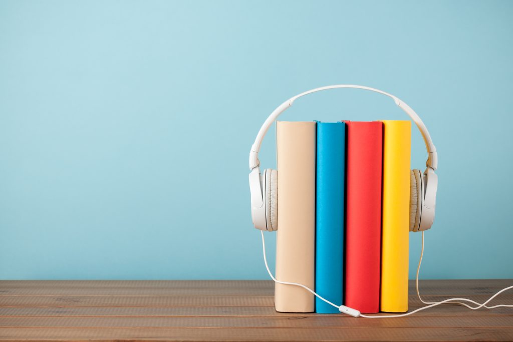 stack of books with headphones 2021 08 26 15 42 04 utc