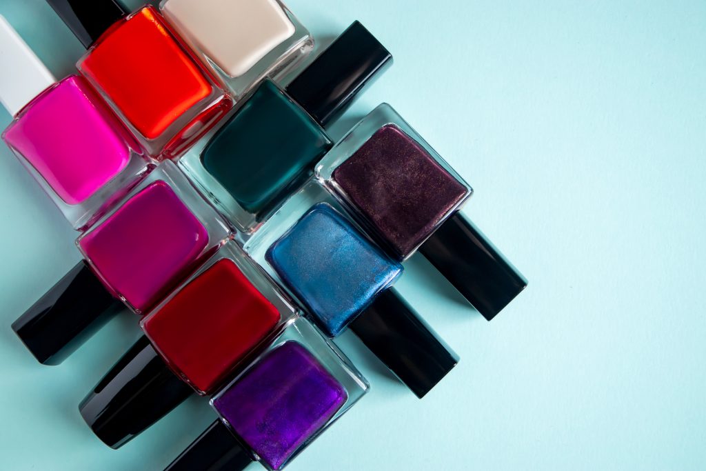 palette of bright nail polishes on blue background 2021 09 23 22 34 35 utc