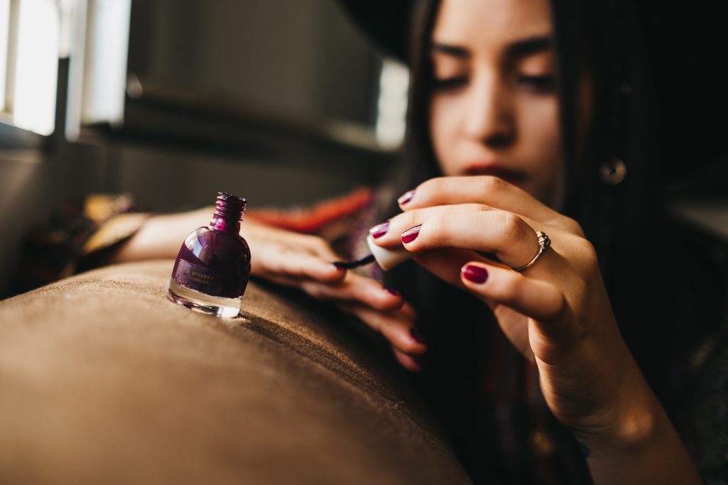 young woman applying nail polish 2022 03 04 05 34 18 utc