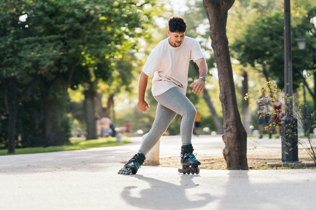 man skating with inline skates in a paved path of 2022 05 06 02 24 08 utc