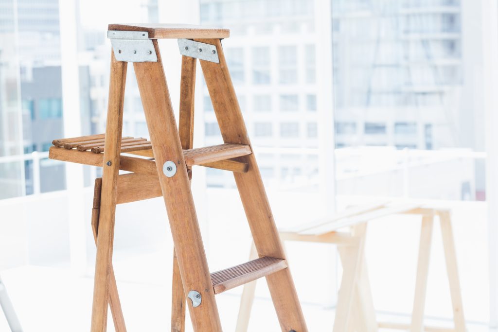 wooden step ladder in bright office 2021 08 28 16 05 45 utc