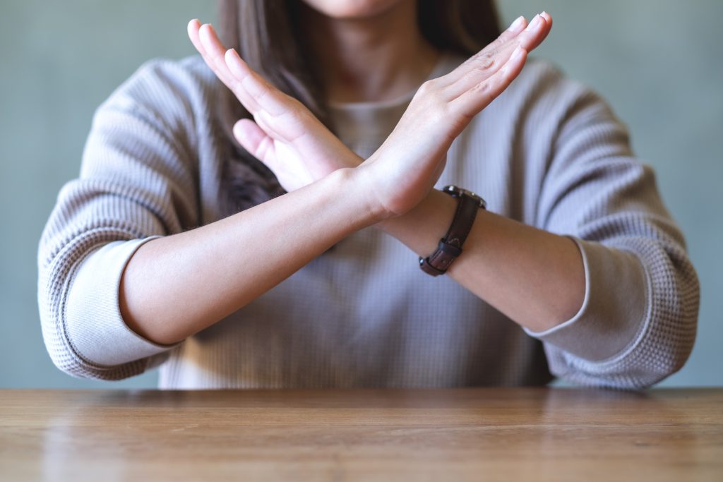 closeup image of a woman making crossed arms sign 2022 12 16 04 58 42 utc